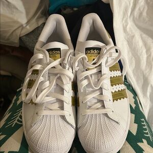 Adidas White Shoes with Gold and Green Accents